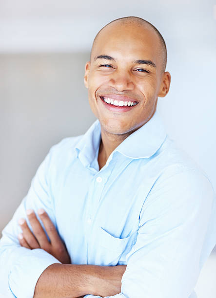 istock Business man with arms crossed smiling 184121201