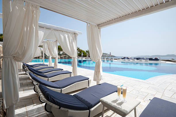 Cocktails in a cabana Cocktails in a cabana beside a resort pool pretty beach house stock pictures, royalty-free photos & images