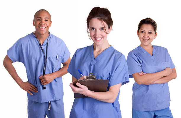 istock Three medical professionals in blue scrubs 184121757