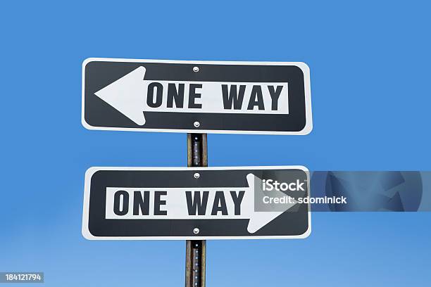 Conflicting One Way Signs Stock Photo - Download Image Now - Humor, One Way, Blue