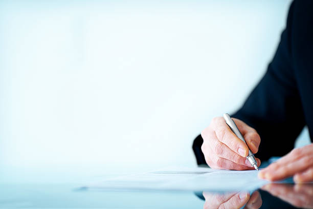 Business man hand writing on paper - Copyspace Cropped image of a business man hand writing on paper - Copyspace money memo stock pictures, royalty-free photos & images