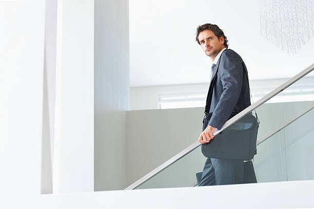 istock Business man walking down the stairs 184122105