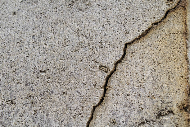 istock Close up abstract textured background of cracked concrete 1841246550