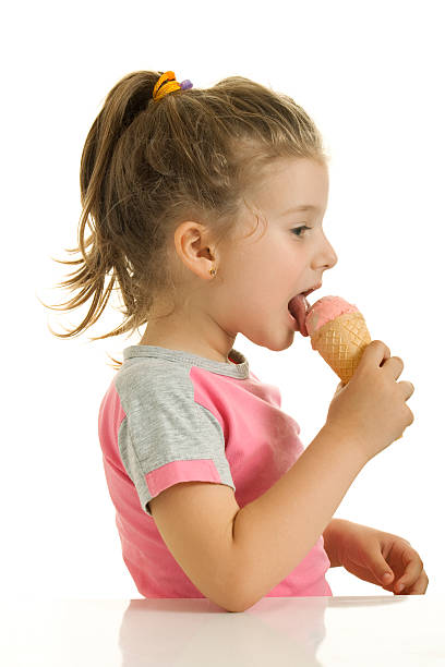 istock Little girl is eating ice cream 184127466