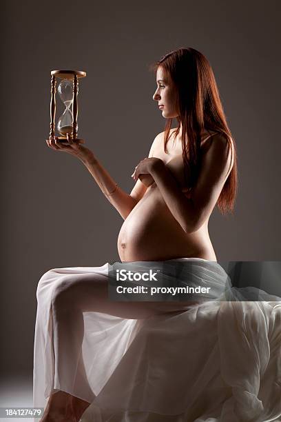 Pregnant Woman With Sandglass Stock Photo - Download Image Now - Abdomen, Adult, Adults Only