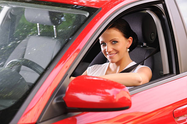istock Beautiful woman driving a car 184127491