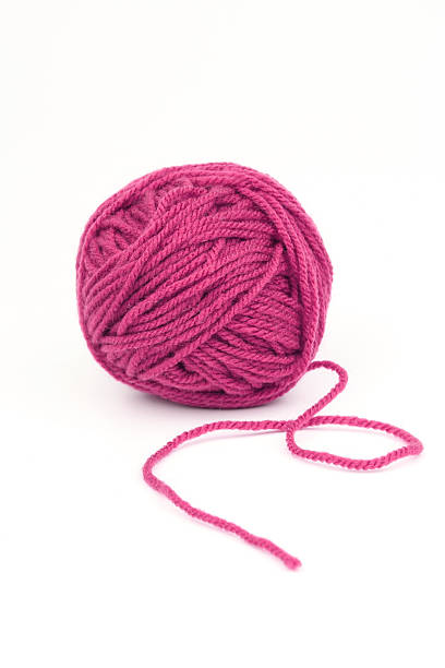 istock Ball of pink yarn on a white background 184128085