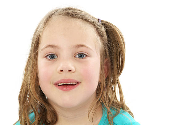 istock Six year old girl smiling on white. 184128249