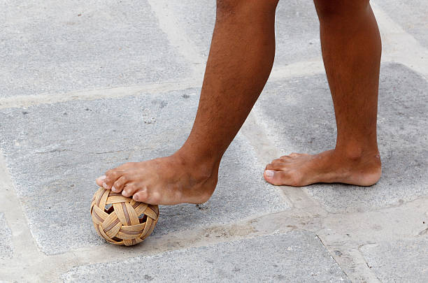 Feet and ball Sepak takraw game stock photo