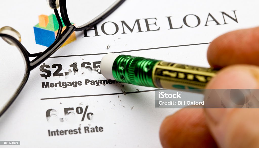 Lower Mortgage Concept for reducing or eliminating mortgage payment. House logo designed by photographer. Budget Stock Photo