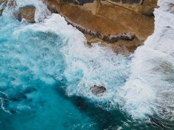 istock The white waves on azure surface of the sea 1841288619