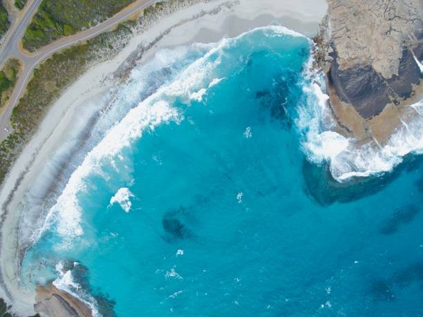 istock The white waves on azure surface of the sea 1841296822
