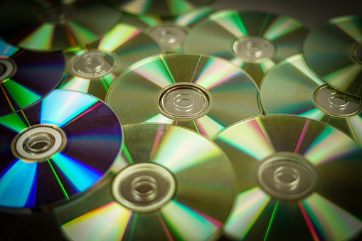 Silver CDs as a background.  Technology concept.