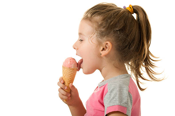 istock Little girl is eating ice cream 184129845