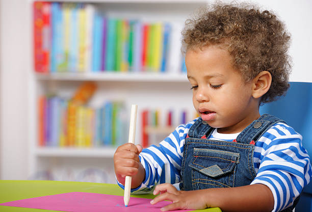 istock Close-up OfToddler During An Art And Craft Session 184129984