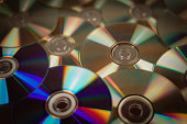 Silver CDs as a background.