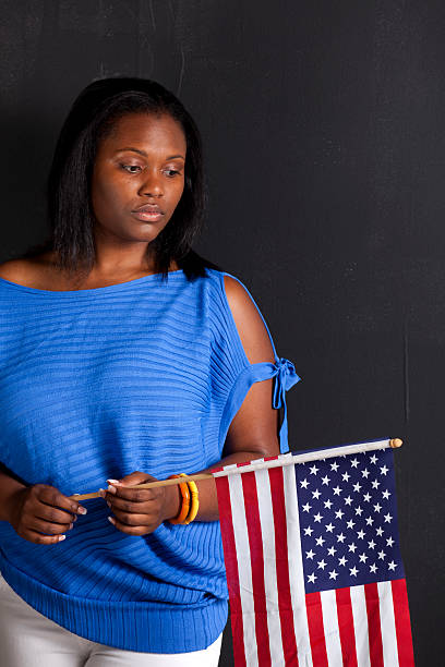istock black female holds American flag 184130042
