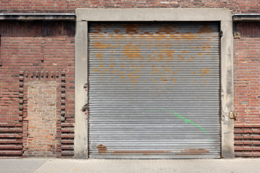 Rolling garage door of an old factory building..