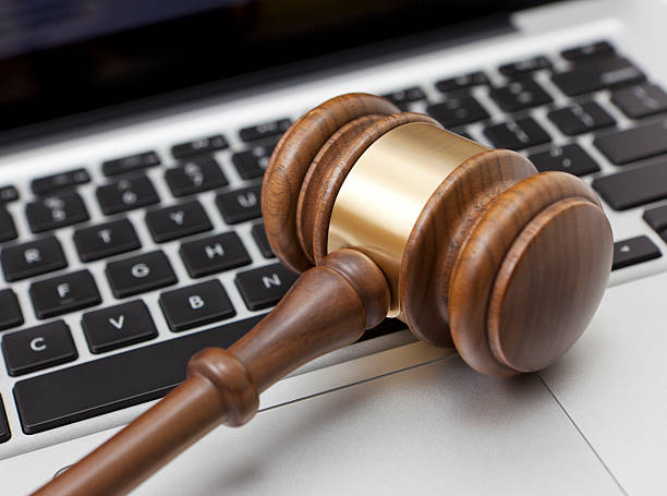 Gavel on laptop Gavel on laptop gavel keyboard stock pictures, royalty-free photos & images