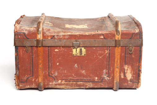 Small dark leather chest with belts - toolbox on vintage retro car, closeup detail.