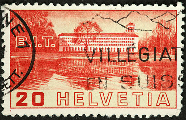 istock old Swiss postage stamp with long building on a lake 184133575