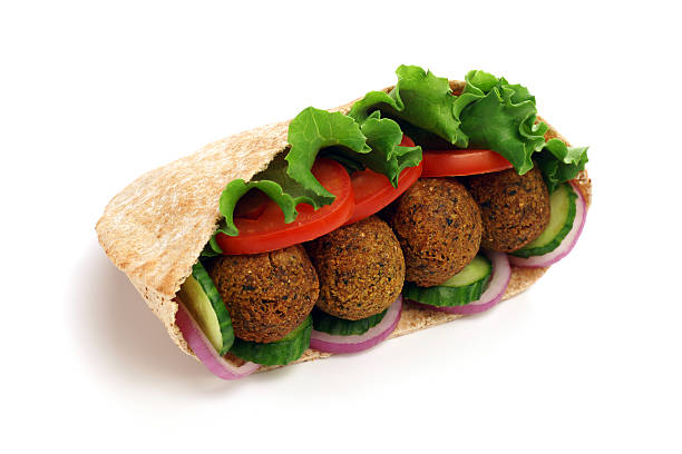 Falafel in Pita "Falafel in pita, isolated on white with shadow.More falafel:" pita bread isolated stock pictures, royalty-free photos & images