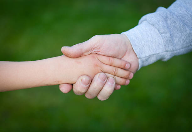 istock Grandfather and grandson's handshake 184134404