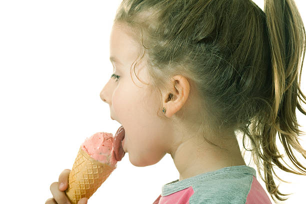 istock Little girl is eating ice cream 184134411