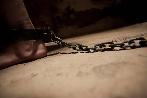 "Shackled and chained, in an old cell, with hand forged shackles.  Focus is on the back of the ankle.Related:"