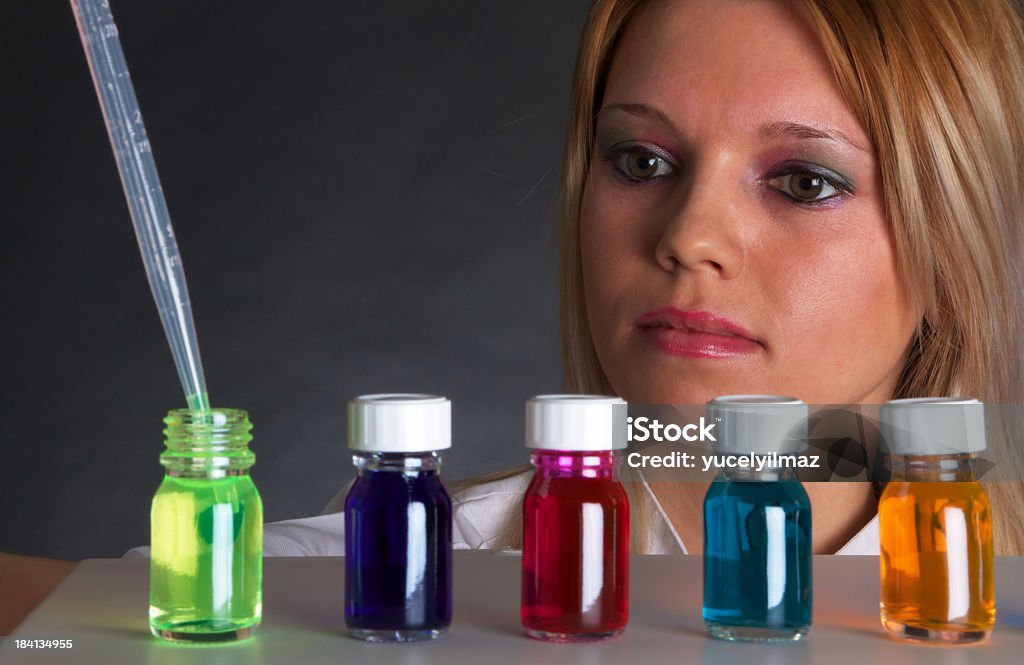 Scientist Woman Working In The Lab With Pipette Young Beautiful Scientist Working With Chemical Liquids. Science and medicine related concept. 20-29 Years Stock Photo