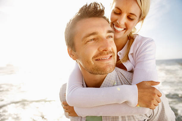 istock Couple having fun on the beach 184134971