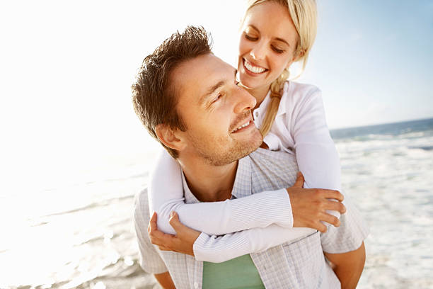 istock Playful couple on the beach 184135202