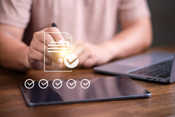 istock E-signing  paperless concept, businessman tick a correct sign on electronic document for paperless office concept. online data management, approve, online database. 1841365432