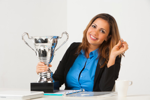 Businesswoman with trophy.View more: