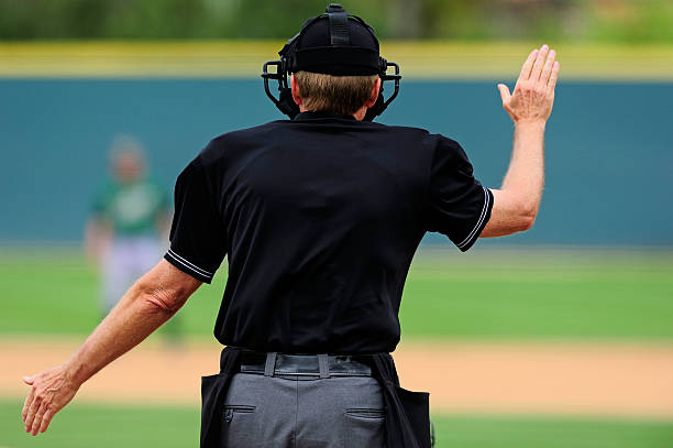 Baseball umpire An umpire makes a ruling on a play during a baseball game. baseball hand signals stock pictures, royalty-free photos & images