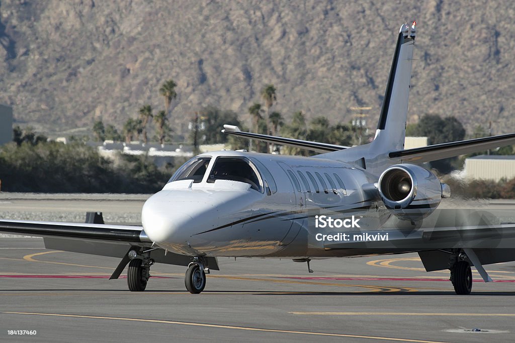 Corporate Jet Business class jet taxiing at Palm Springs Int. Airport. Air Vehicle Stock Photo
