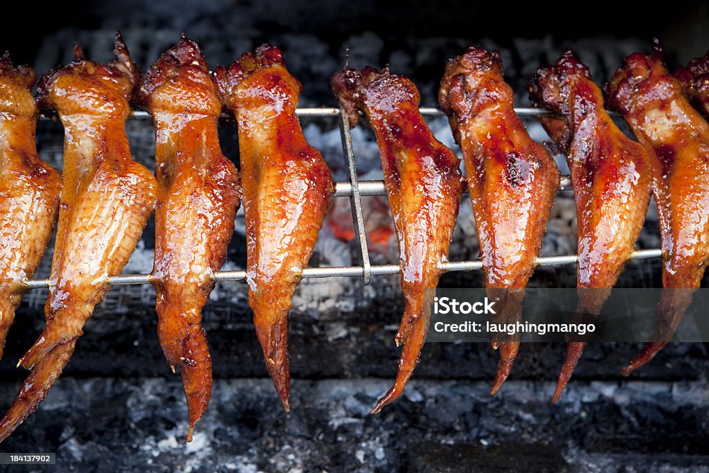 barbequed grilled chicken wings barbequed chicken wings at market stall in malaysia Animal Body Part Stock Photo