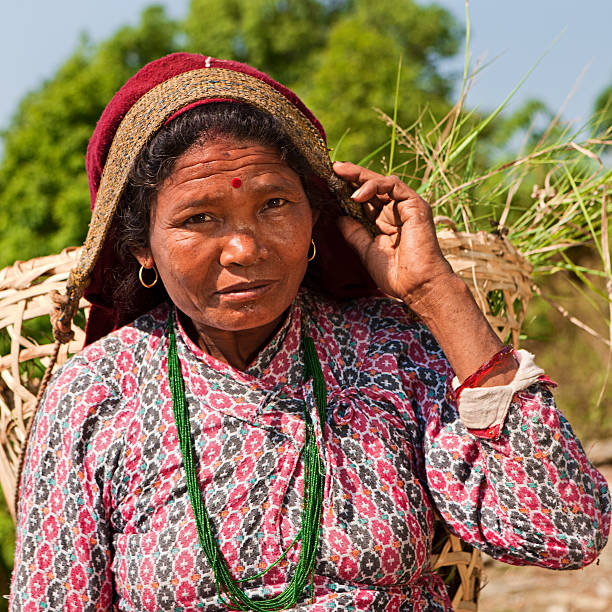 istock Nepali woman carrying basket 184138103