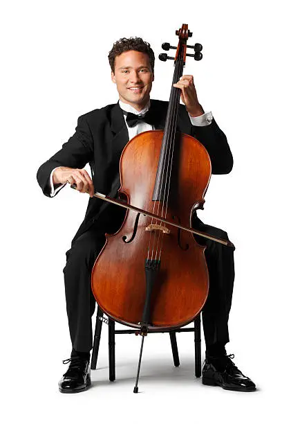 A cello player playing his cello.