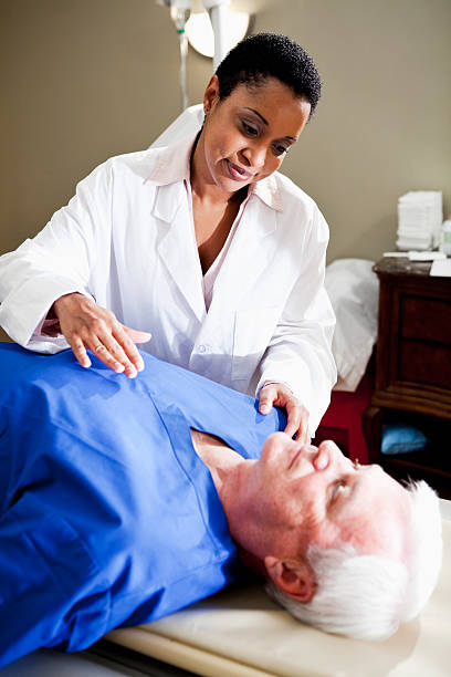 istock Healthcare worker with patient 184138557
