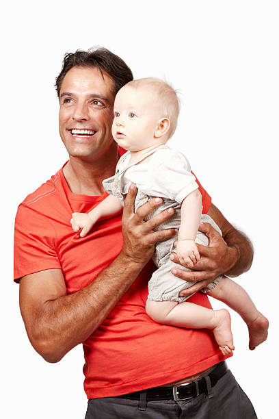 istock Happy father and his staring baby 184138781