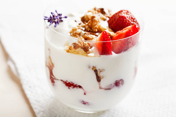 strawberries, walnuts and yoghurt dessert strawberries and yoghurt, covered with walnut and honey, flavoured with lavender parfait stock pictures, royalty-free photos & images