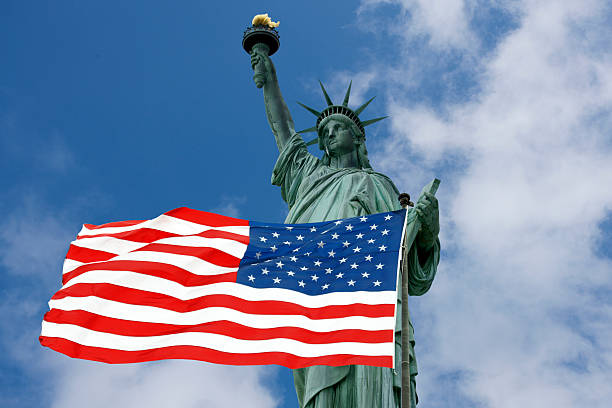 istock Statue of Liberty and USA Flag 184140992