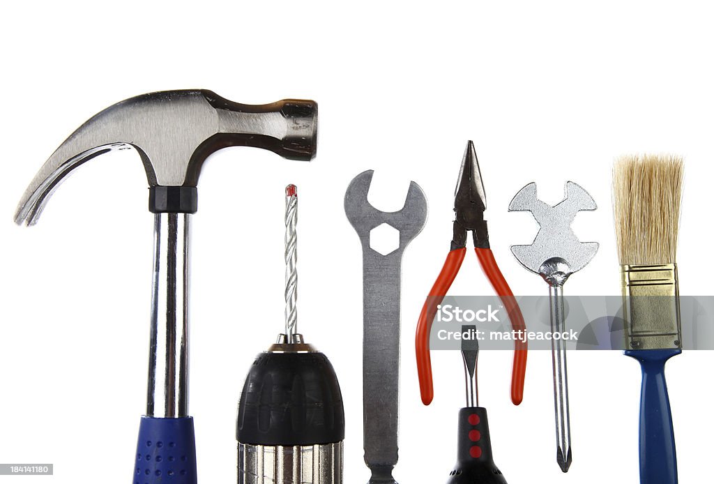 Variedade de ferramentas de construção de mão Isolado no branco - Foto de stock de Alicate royalty-free
