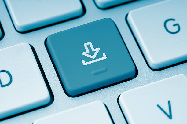 Download button on a computer keyboard Computer Keyboard with symbolic download key Stream stock pictures, royalty-free photos & images