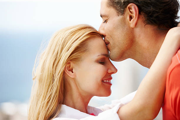 istock Man kissing woman 184141812
