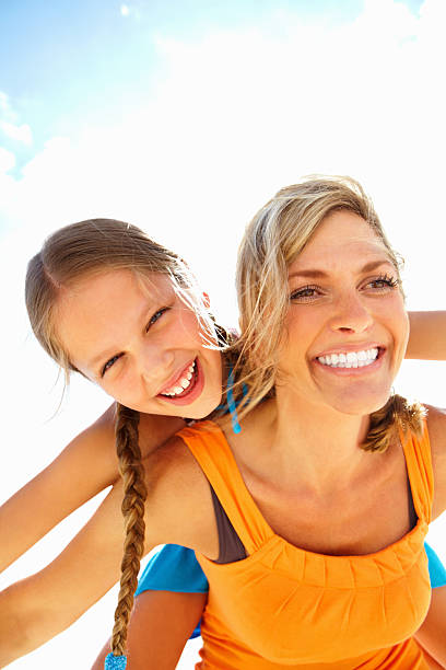istock Girl enjoying a back ride on middle-aged mother 184141837