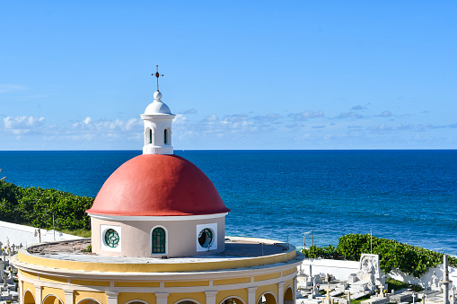 Ocean view overlooking the historic, oceanfront, colonial-era Santa Maria Magdalena de Pazzis Cemetery or Old San Juan Cemetery on the island of Puerto Rico, United States.