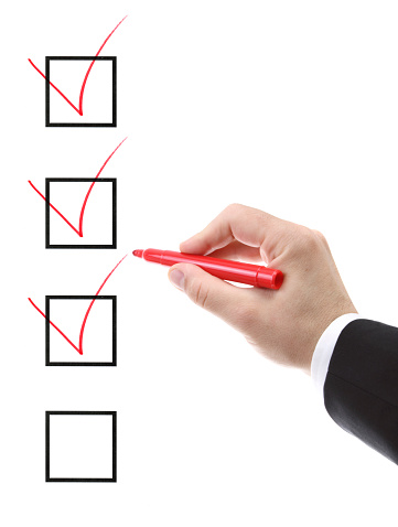 businessman filling a checklist