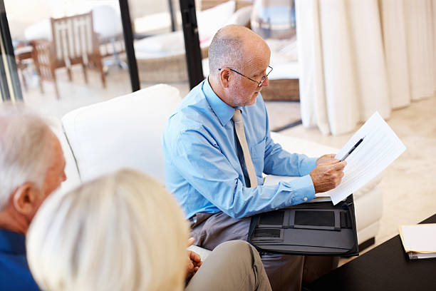 istock Financial advisor explaining to senior couple 184142457